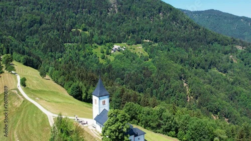 Aerial morning view of St. Primoz church at Jamnik, Slovenia, Julian alps. photo