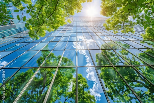 Exemplifying the ESG - Environmental  Social  Governance concept  a corporate glass building facade reflects green trees. Importance of integrating sustainability into business practice.