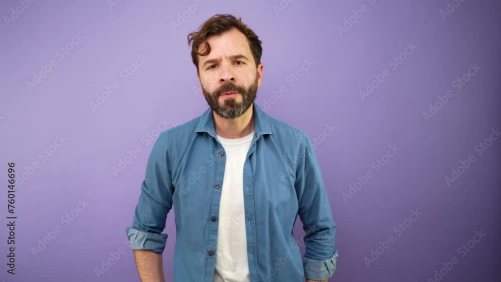 Furious man trying to control his anger in a studio Furious man trying to control his anger in a studio