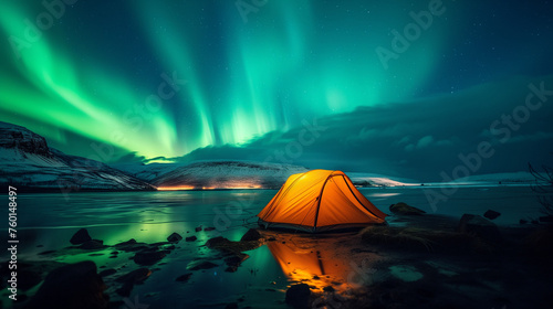A glowing yellow camping tent under a beautiful green northern lights aurora. Travel adventure landscape background. Photo composite. photo
