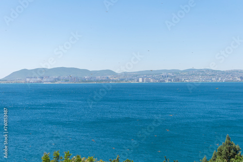 Obraz na płótnie Sea horizontal landscape - blue sky, blue sea, mountain hills on the horizon w salonie