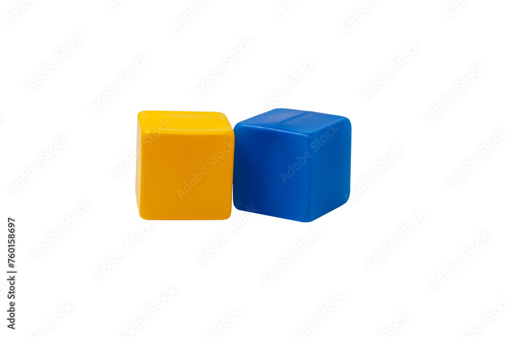 Multicoloured plastic cubes for children's games. Yellow and blue cubes are lying side by side. No background. One next to the other. Horizontally. High quality photo. Multicoloured plastic cubes for children's games. Yellow and blue cubes are lying side by side. No background. One next to the other. Horizontally. High quality photo.
