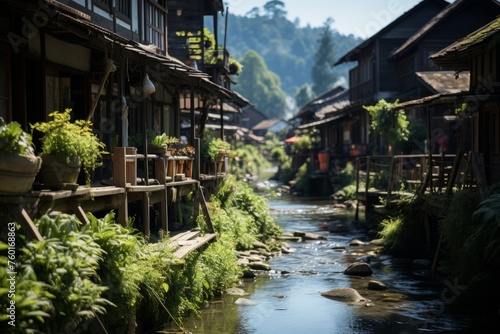 Village with river, trees, buildings, and natural landscape