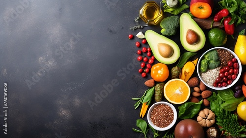 A sumptuous display of colorful fruits and vegetables arranged on a dark surface with space for text