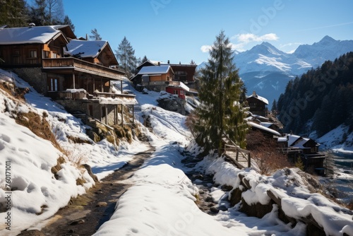 A freezing snowy village on a mountain slope with a river running through it © yuchen