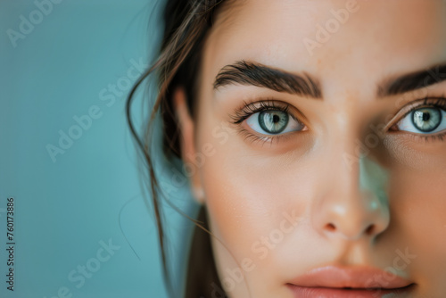Close-Up View of a Young Woman's Face with a Touch of Facial Treatment Product and Natural Beauty
