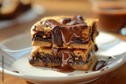 Layered Chocolate Chip Cookie Bars Drizzled with Rich Chocolate Sauce