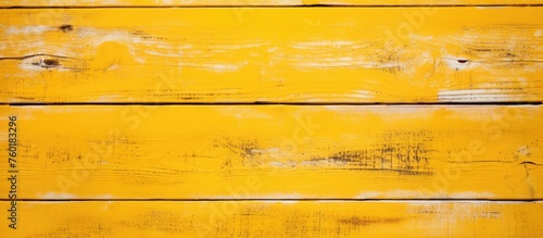 Wallpaper Mural A close up of a yellow hardwood wall with a distinctive amber wood stain. The rectangular panels are arranged in a parallel pattern, showcasing different tints and shades of yellow Torontodigital.ca