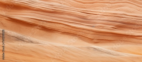 A close up of a sand dune in the desert, showcasing a beautiful blend of brown, amber, peach, and beige hues. Just like a hardwood flooring ingredient made of plywood and wood