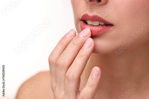 Woman with beautiful lips on white background, closeup. Space for text