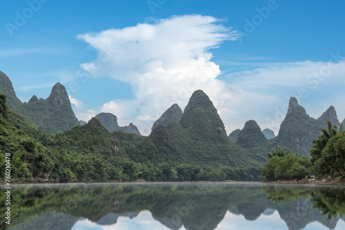 Tranquil River Reflections and Limestone Peaks