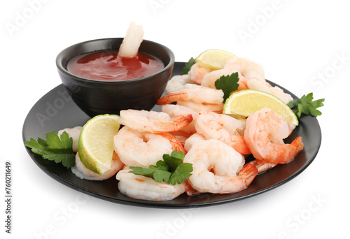 Tasty boiled shrimps with cocktail sauce, lime and parsley isolated on white