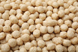 Tasty sweet cereal balls as background, closeup