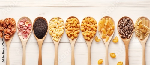 Assortment of Pasta Varieties Presented on Rustic Wooden Spoons for Culinary Inspiration