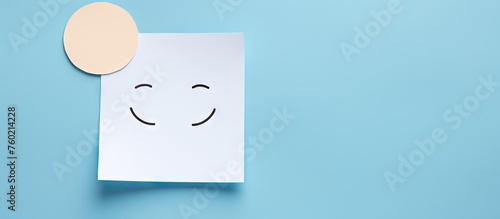 Cheerful Emotion Concept: Handcrafted Paper Smiley Face on Vibrant Blue Background