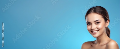 Bright blue background Portrait of smiling beautiful woman smooth clean face glowing skin youth skin care ad concept from Generative AI