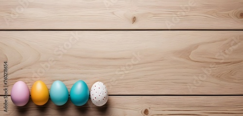 Wooden background with painted easter eggs and copy space. Easter festival celebration