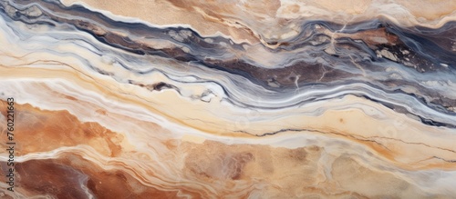 A close up of a marble texture with a swirl pattern resembling brown fluid cuisine. The natural material, art event showcases the beauty of liquid bedrock