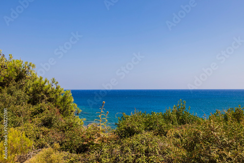 Beautiful panoramic view of the mountainous Aegean coastline on the picturesque island of Rhodes, Greece.