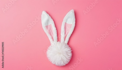 Bunny ears made from fluffy white wool on a pink background. Easter Day © LilithArt