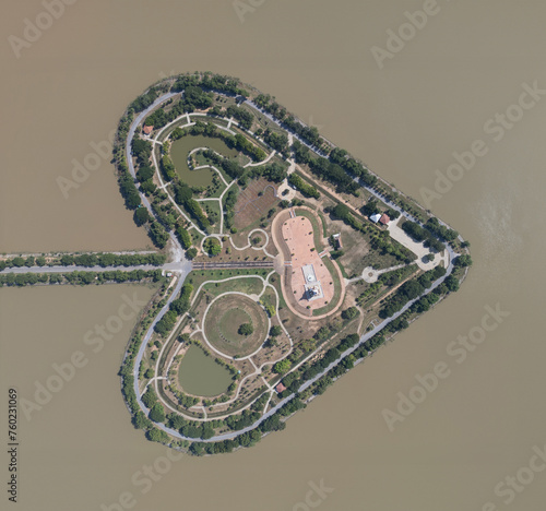 Aerial top view of Heart island in Sukhothai province, Thailand. Forest trees in nature landscape background.