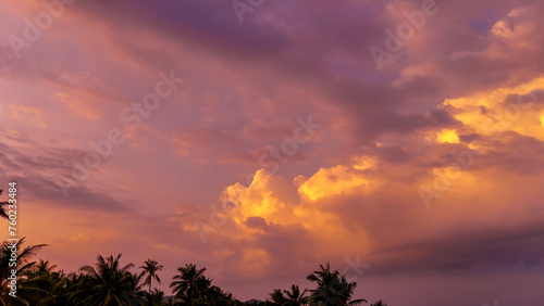 Nature sunset sky aerial view. Top view evening atmosphere when the cloud sky golden time. Countryside road that cuts through. Photo for background feeling free  mood and tone relax happy time
