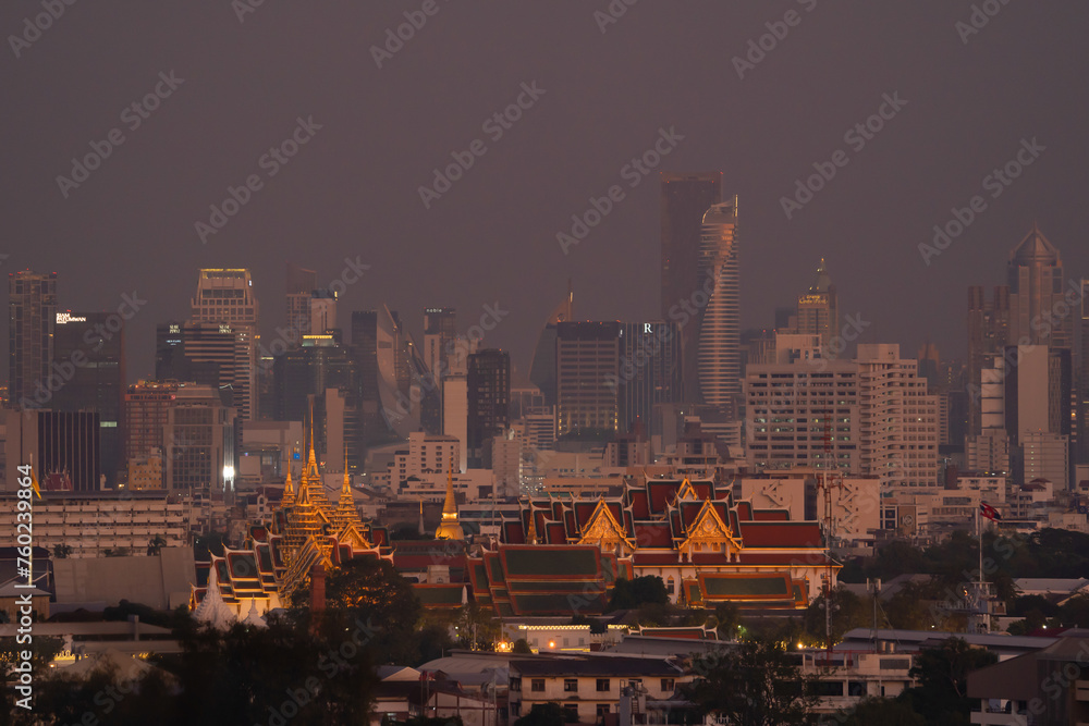 Golden pagoda at Temple of the Emerald Buddha in Bangkok, Thailand. Wat Phra Kaew and Grand palace in old town, urban city. Buddhist temple, Thai architecture. A tourist attraction.