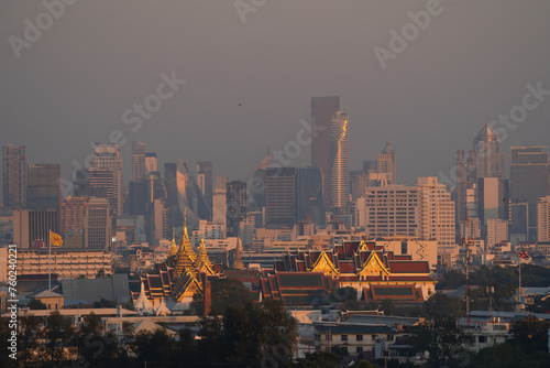 Golden pagoda at Temple of the Emerald Buddha in Bangkok, Thailand. Wat Phra Kaew and Grand palace in old town, urban city. Buddhist temple, Thai architecture. A tourist attraction.