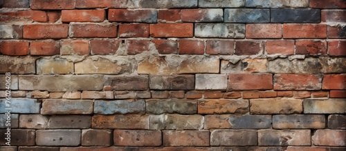 A closeup of a brown brick wall showcasing intricate brickwork and rectangular patterns. The composite material resembles a stone wall with a unique font