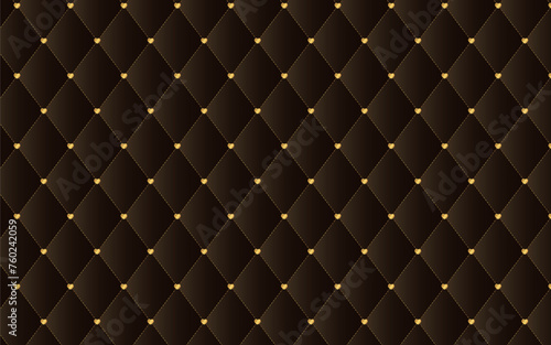 金色のハートの留め具のブラウンのキルティング生地の背景