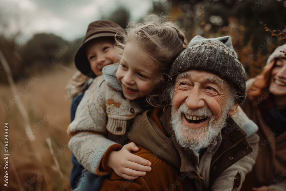 A heartwarming family photo captures the grandfather being embraced by two of his grandchildren as they hike through the woods. A heartwarming family photo captures the grandfather being embraced by two of his grandchildren as they hike through the woods.