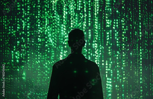 silhouette of man in front of green matrix code background