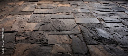 A detailed shot of hardwood flooring made of wooden tiles, resembling a bedrock formation in a building. The wood texture mimics the natural landscape with its intricate patterns