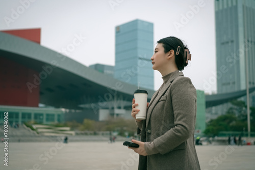 Young Professional Enjoying Coffee and Music Outdoors