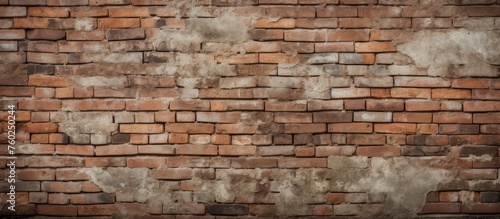 A detailed closeup photograph showcases the intricate patterns of an old brown brick wall  highlighting the use of brick as a durable building material