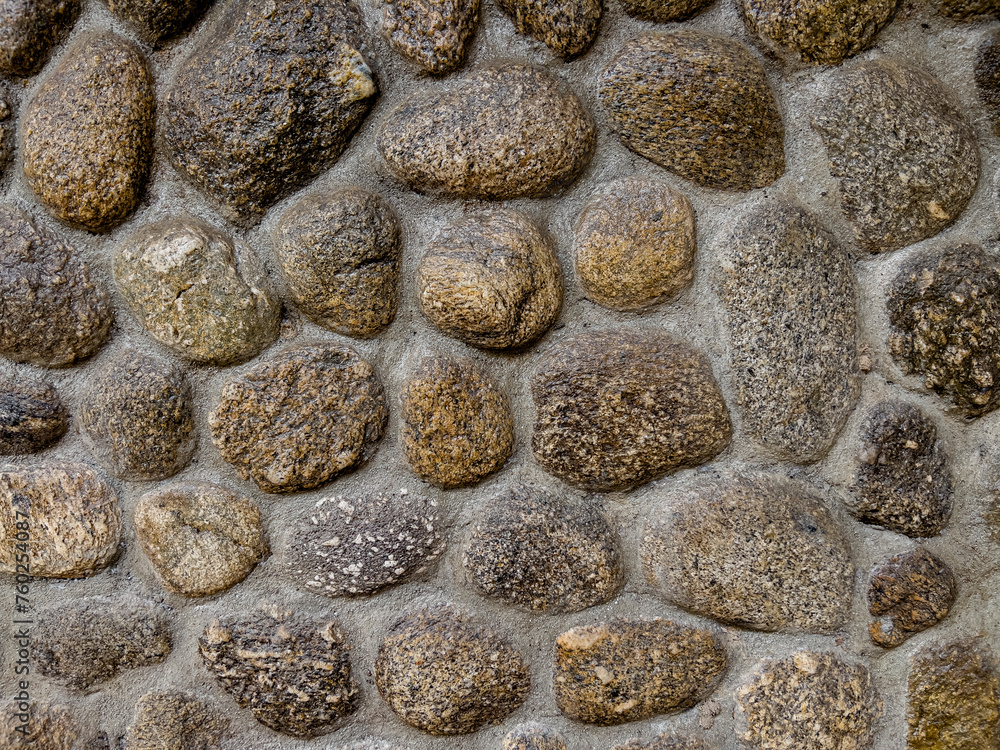 Close-up Stone Wall Texture Background with Gray Pebbles and Rocks on Beach Close-up Stone Wall Texture Background with Gray Pebbles and Rocks on Beach