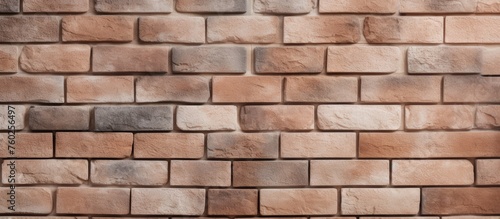 A detailed shot showcasing the brown brickwork pattern of a brick wall, a composite building material made from soil and cobblestones forming rectangular shapes for flooring or stone walls