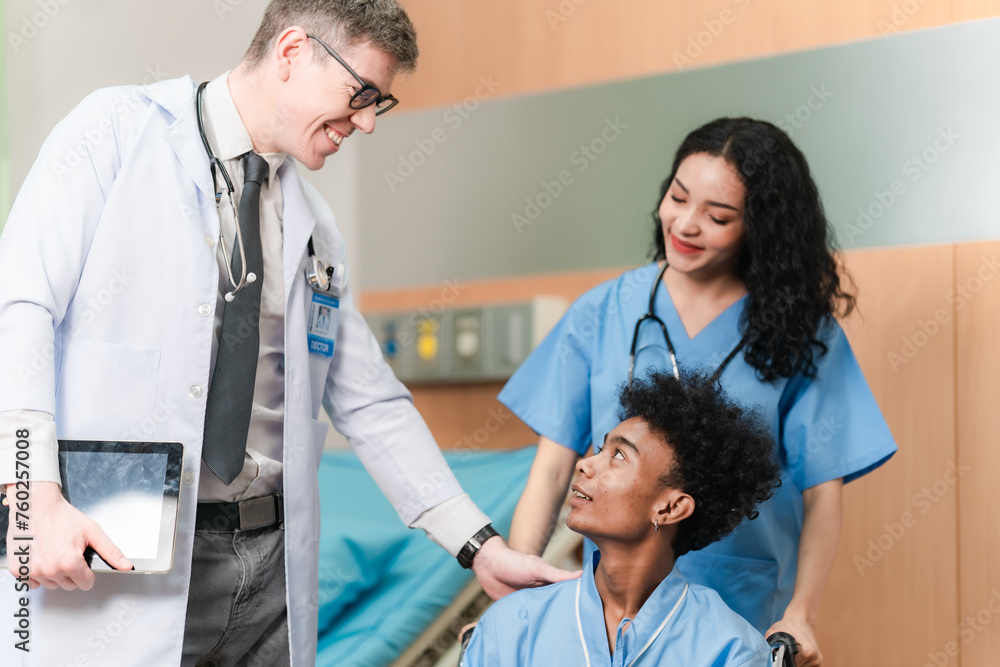 Obraz premium Doctor and African American patient talking in hospital ward about diagnosis and treatment for teenager in bed. Black specialist man with stethoscope consulting sick young adult