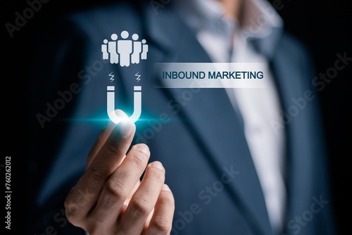 Inbound marketing strategy concept. Creating attraction for customer groups. Businessman holding inbound marketing icon on virtual screen.