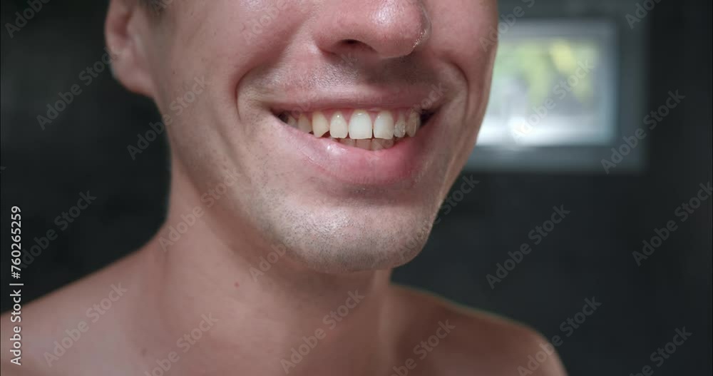 Smiling Is Catching Close-up confident man in bathroom showing off his dazzling smile. Snow ...