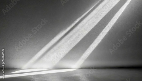 abstract light background  Natural light flares on white wall texture background. White stucco wall surface background with diagonal light beam and shadows lines and silhouettes for backgrounds  overl