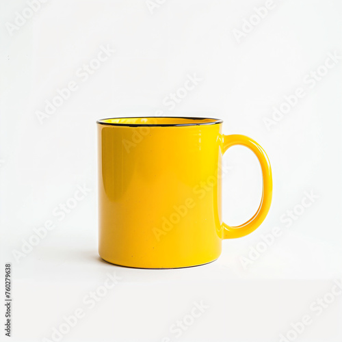 a yellow mug with a black rim on a white surface