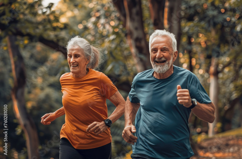 Happy senior couple doing sport in the park, healthy lifestyle concept. Smiling old man and woman running outdoors on a summer day