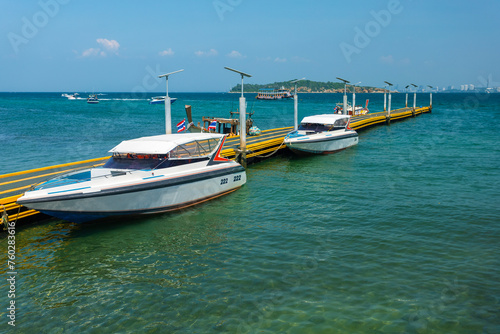  Speed boats at Na Ban pier at island of Kohlarn, Thailand. Boats take tourists to the Koh Larn island from Pattaya, Thailand.
