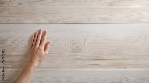 Graceful Touch: A Woman's Delicate Hands Resting and Feeling Wooden Surface with Serenity and Connection