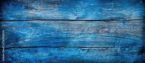 Soothing blue wood texture background illuminated by soft lighting for design projects