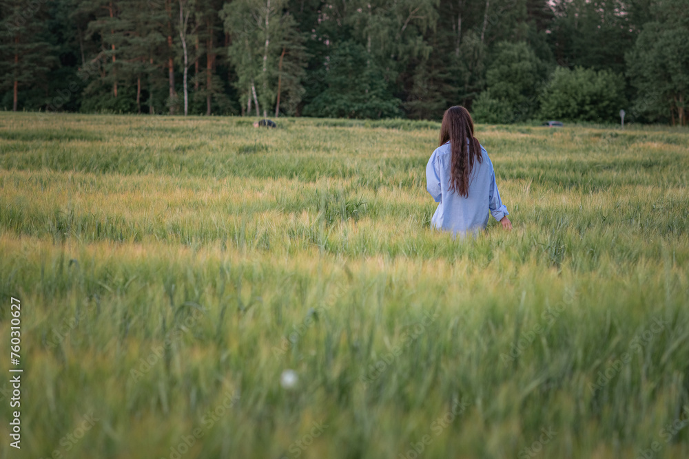 Portrait of a young beautiful dark-haired girl on a summer field. Portrait of a young beautiful dark-haired girl on a summer field.