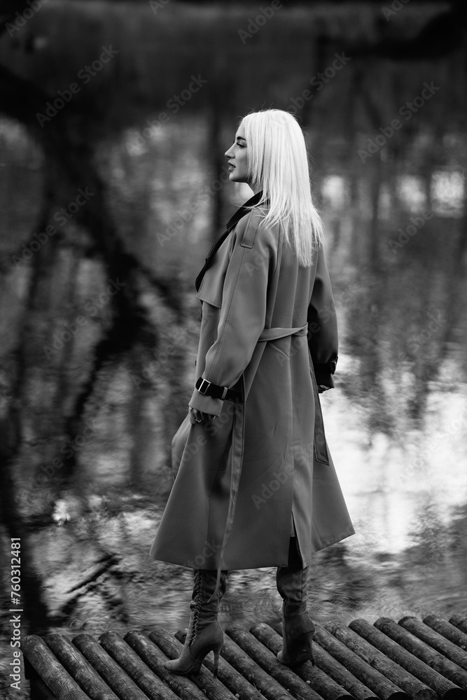 Fototapeta premium Portrait of a young beautiful blonde girl outdoors.