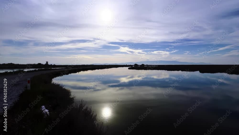 The Lake Water in Sunny day near the Road The Lake Water in Sunny day near the Road