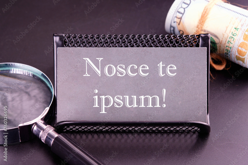 Latin proverb NOSCE TE IPSUM (know yourself) on the business card next ...